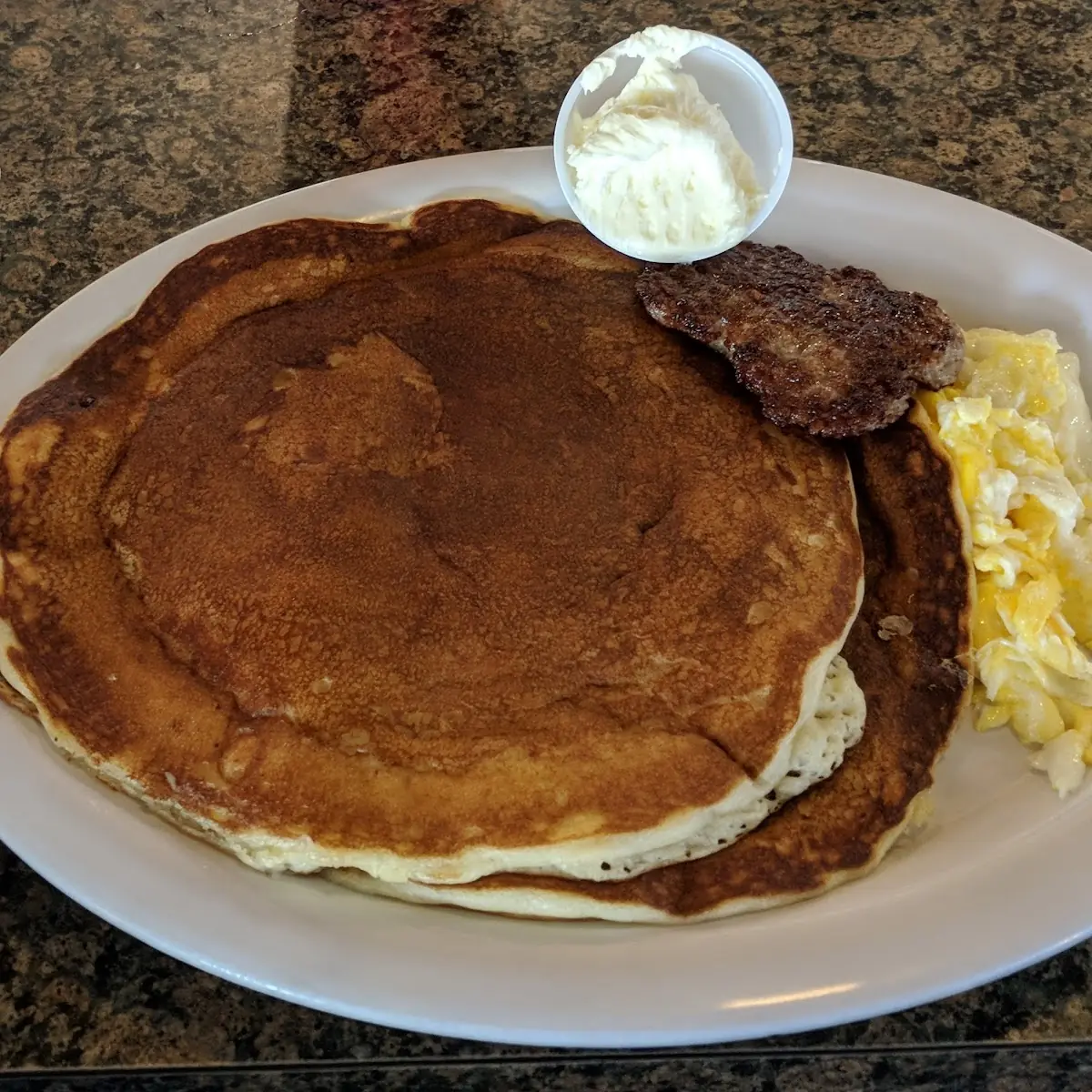 Short Stack of Pancakes with Sausage and Eggs