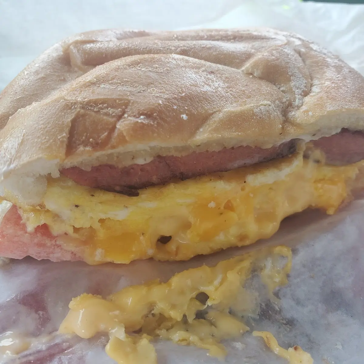 Sausage Egg w Cheese on a Roll with Tomato