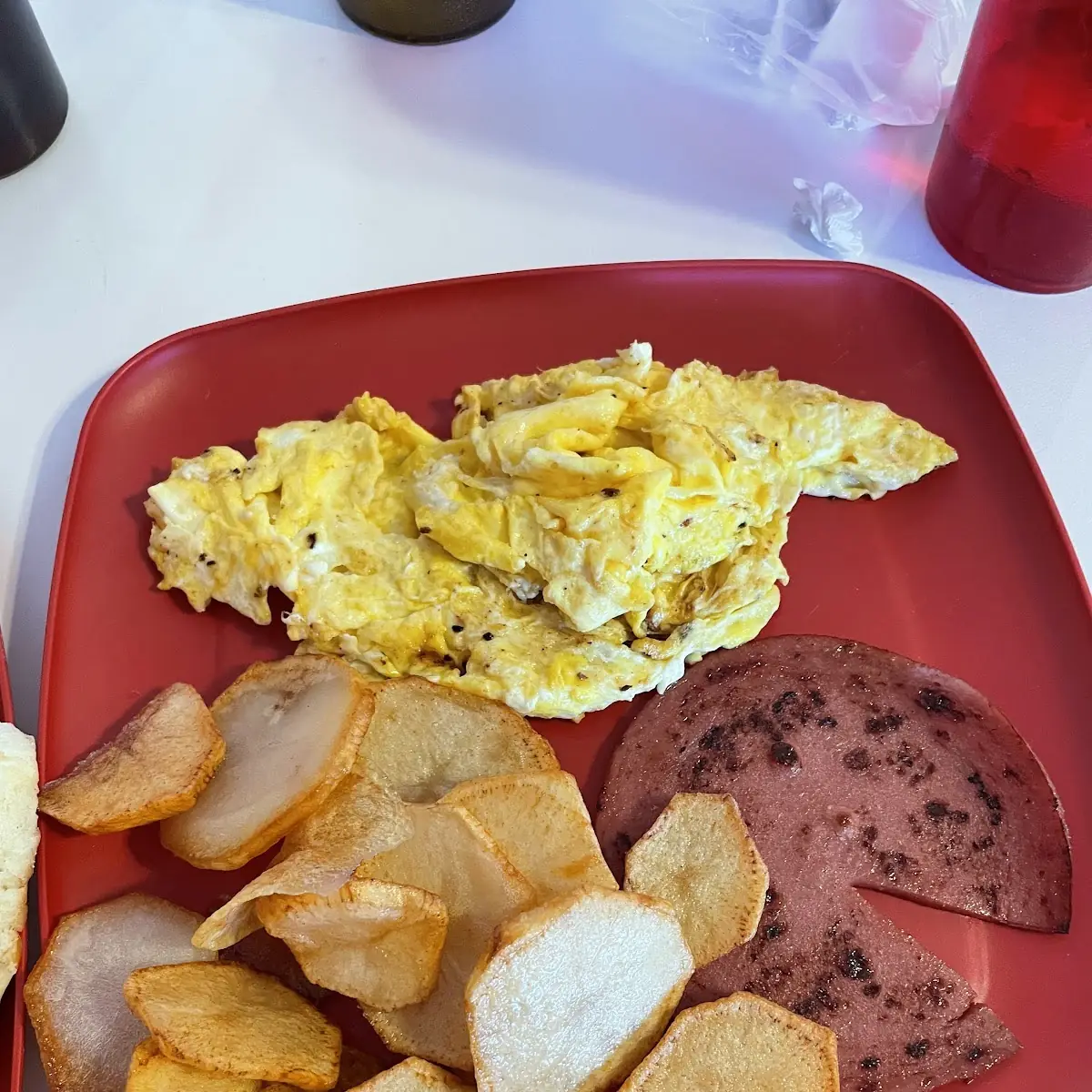 The Big Breakfast with Scrambled Eggs Home Fries and Fried Bologna