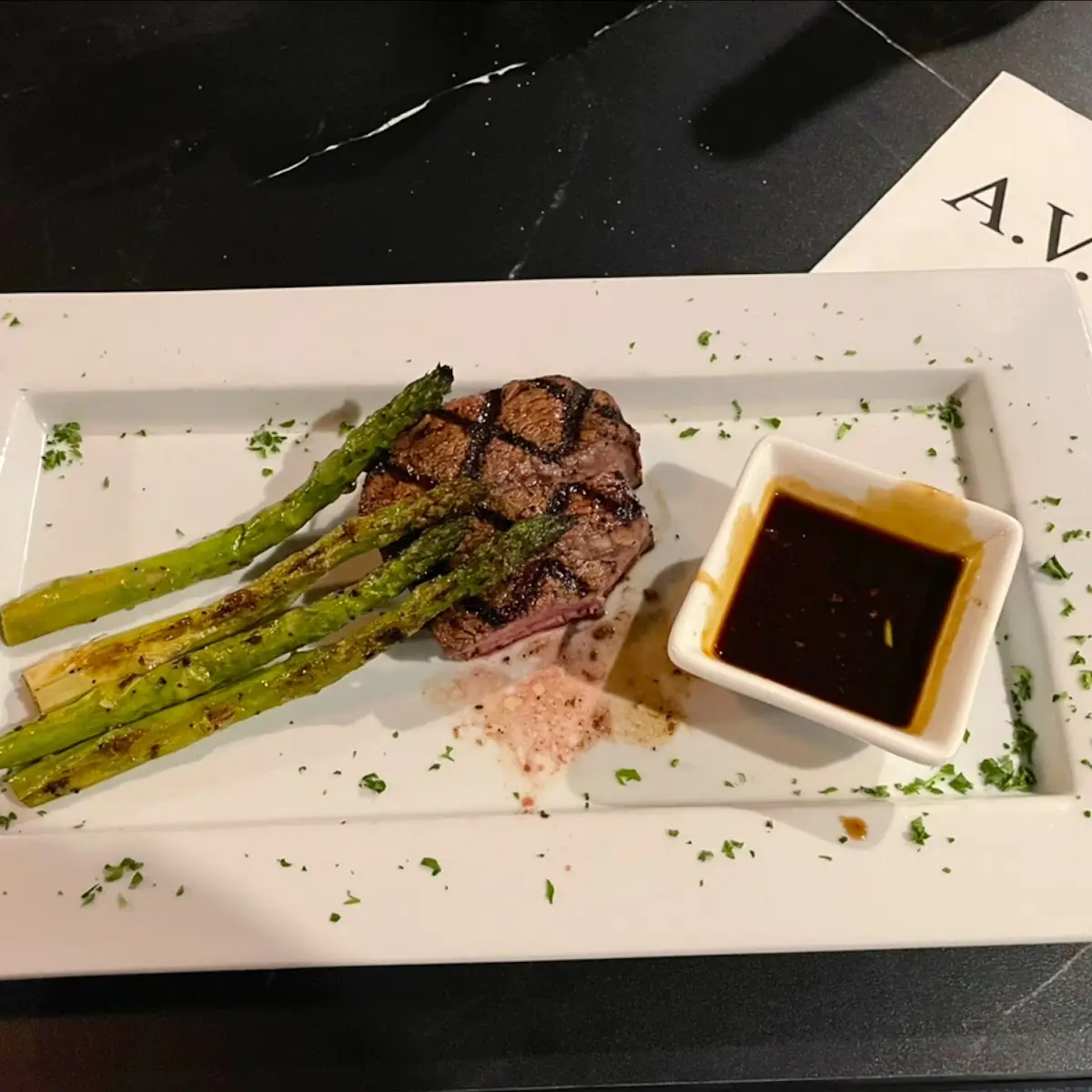 Perfectly Executed Medium Rib Eye Under Asparagus