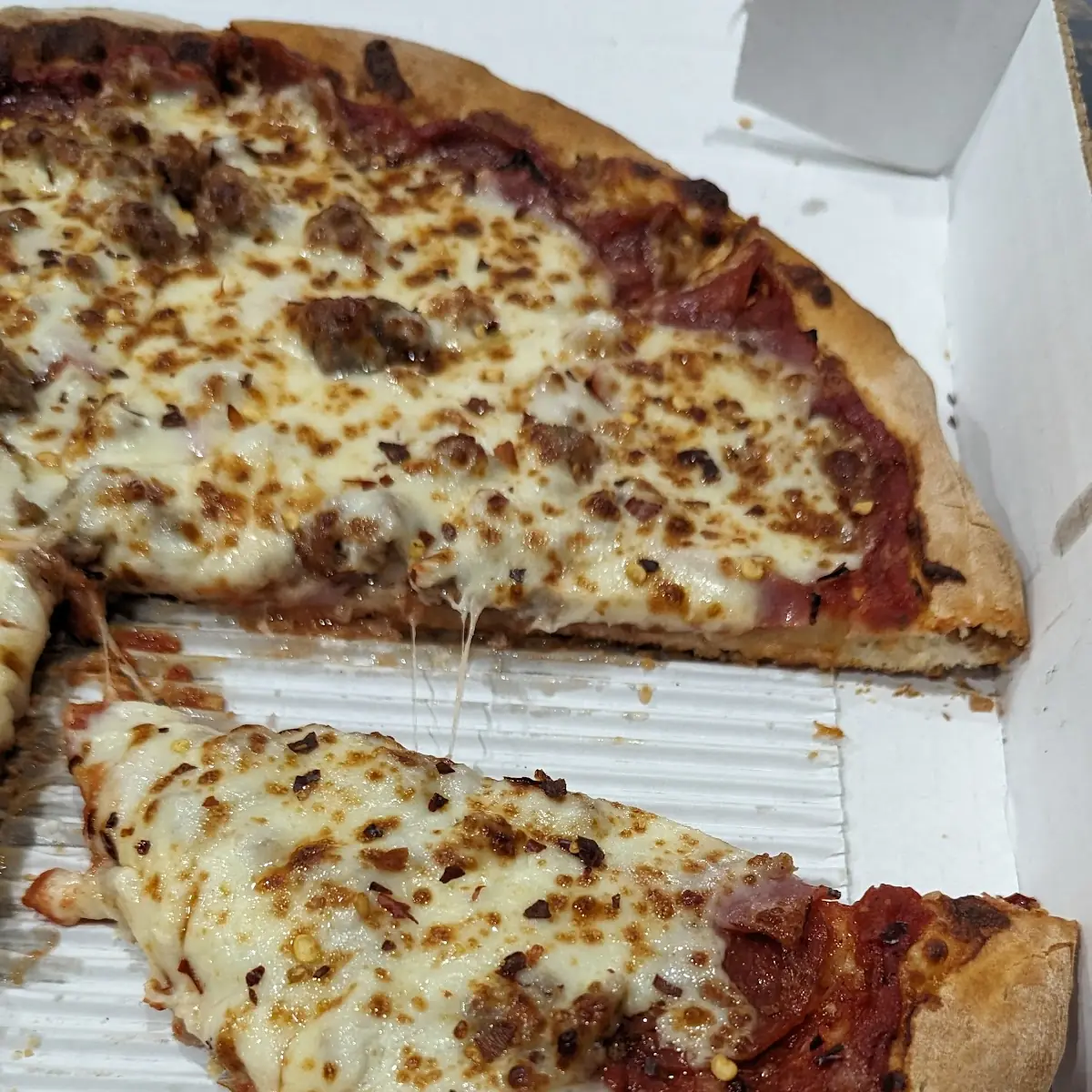 Ham Pepperoni Sausage Pizza Slice