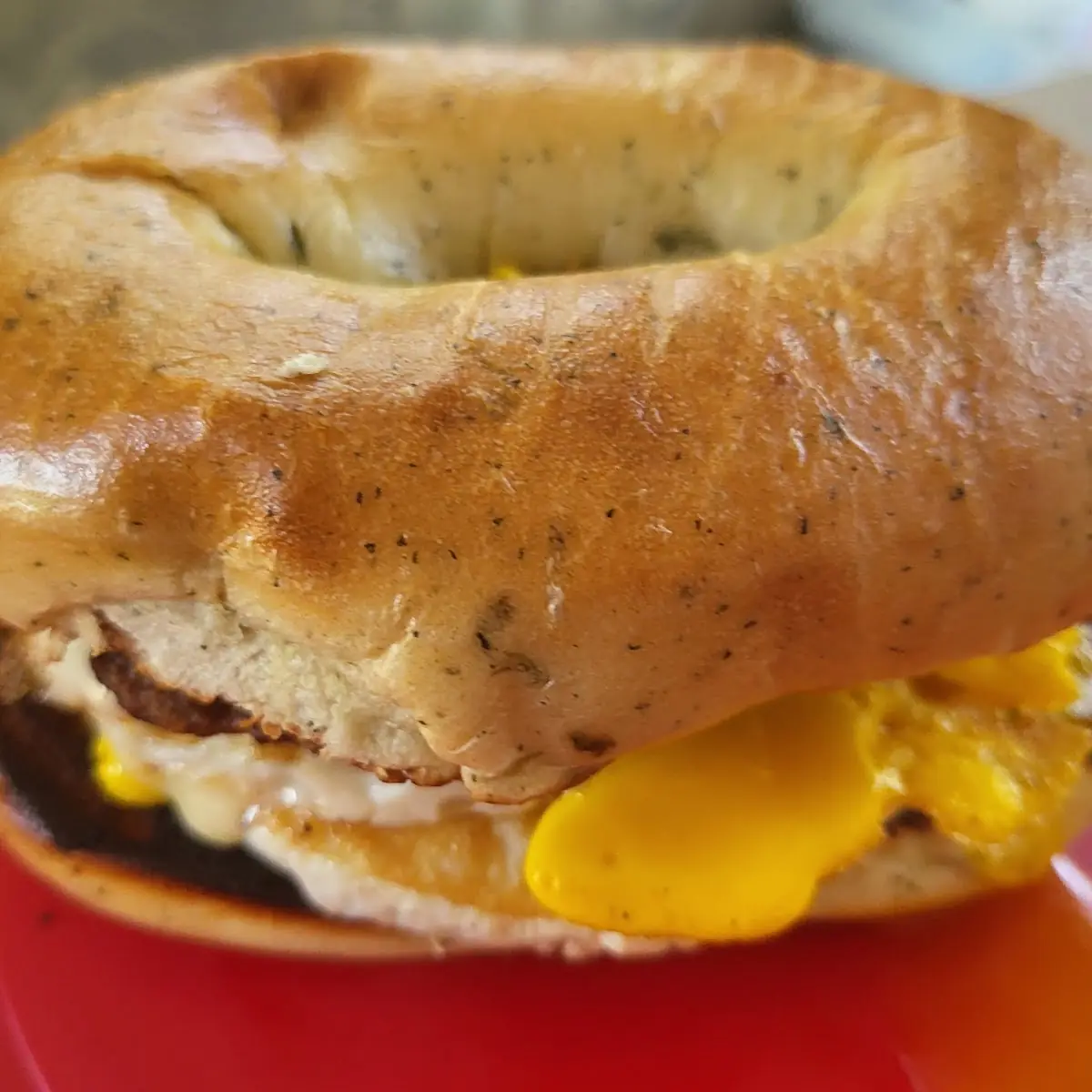 Sausage Egg and Cheese on Spinach Bagel
