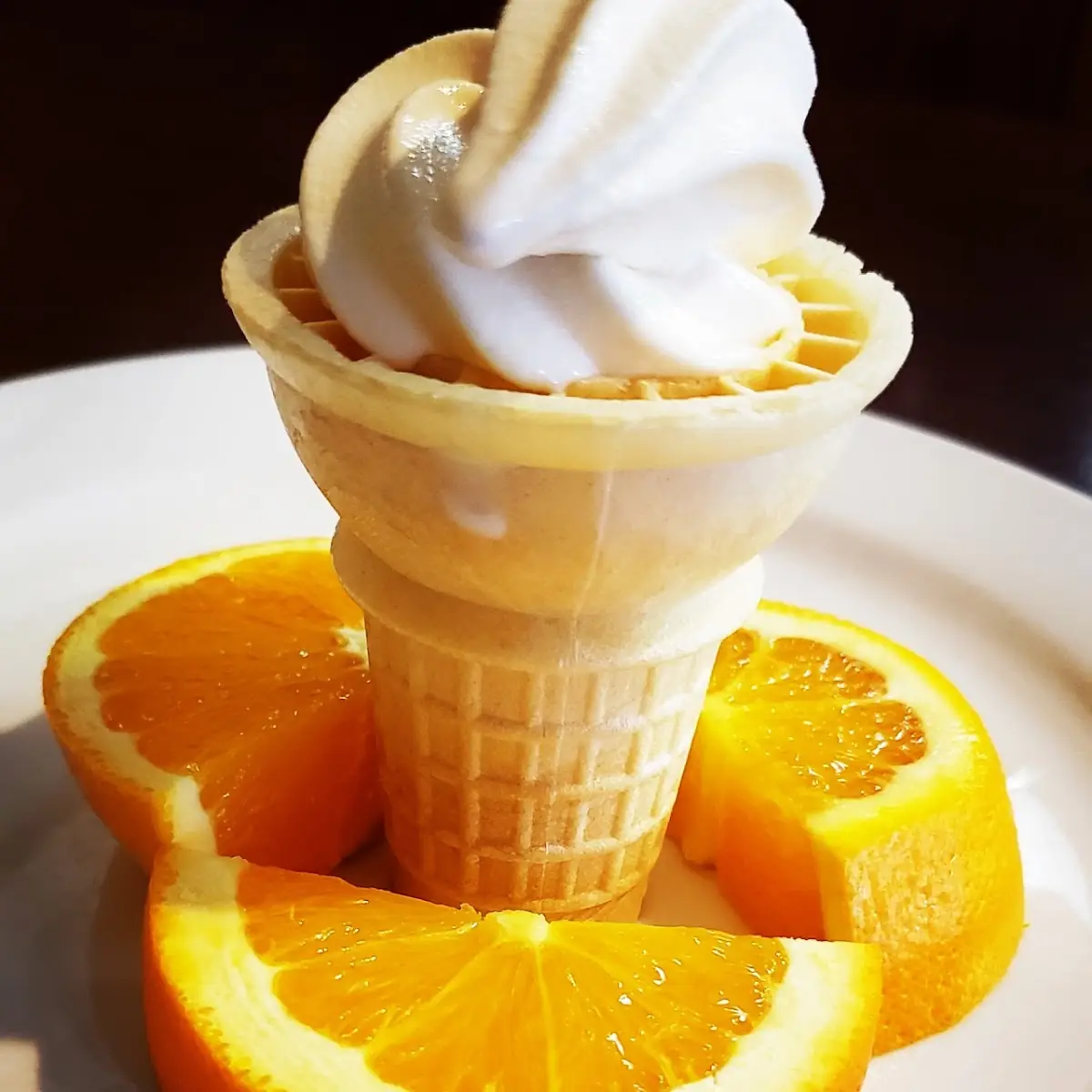 Vanilla Ice Cream Cone and Orange Slices