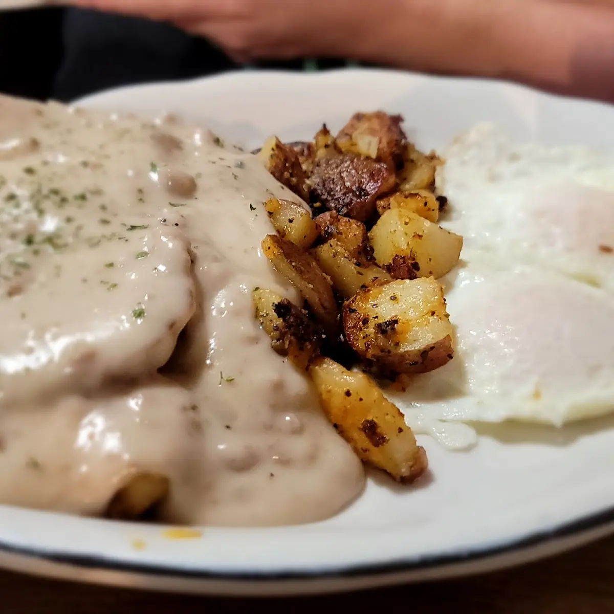 Sausage Gravy over Biscuits with 2 Eggs and Homefries