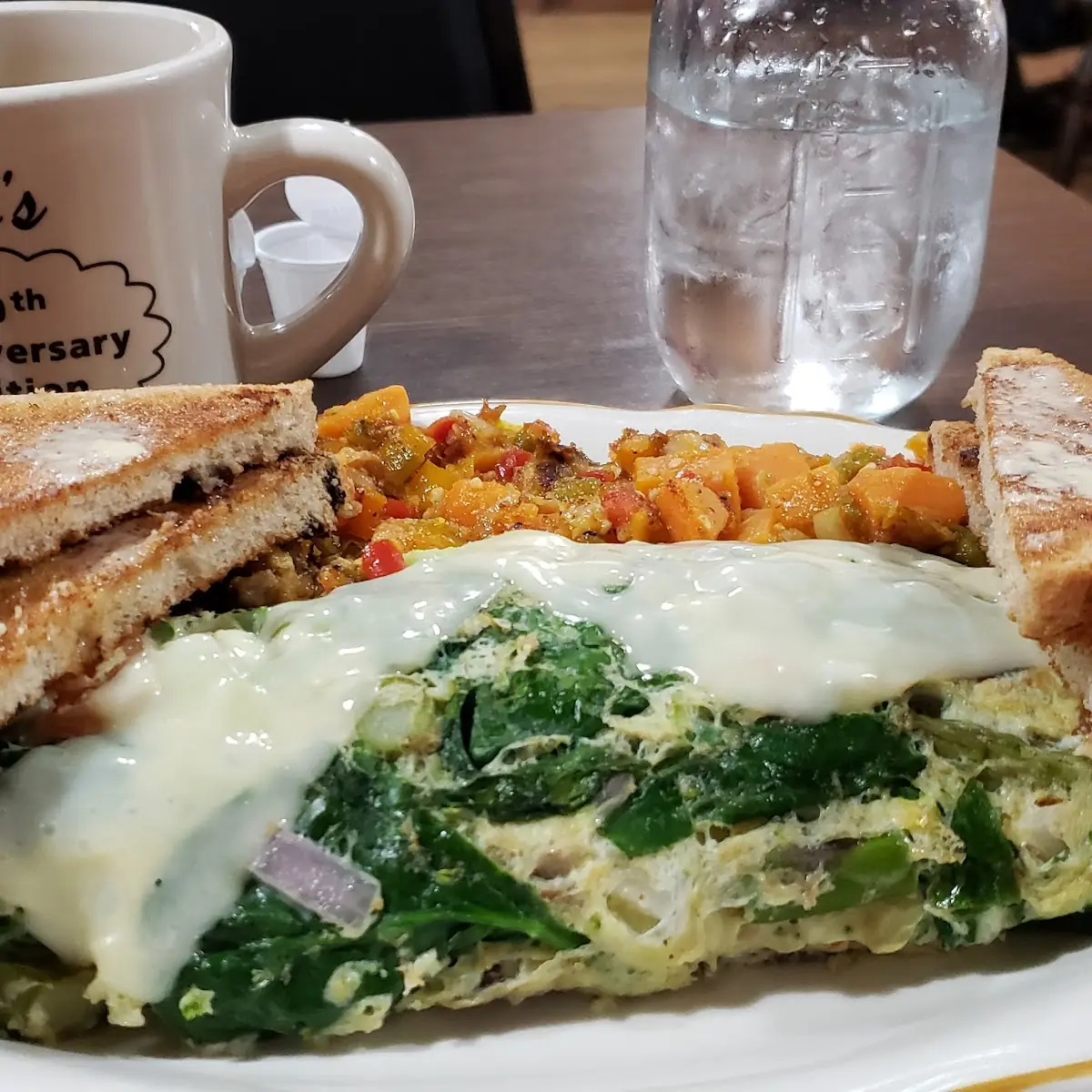 Veggie and Swiss Omelets with Sweet Potato Hash