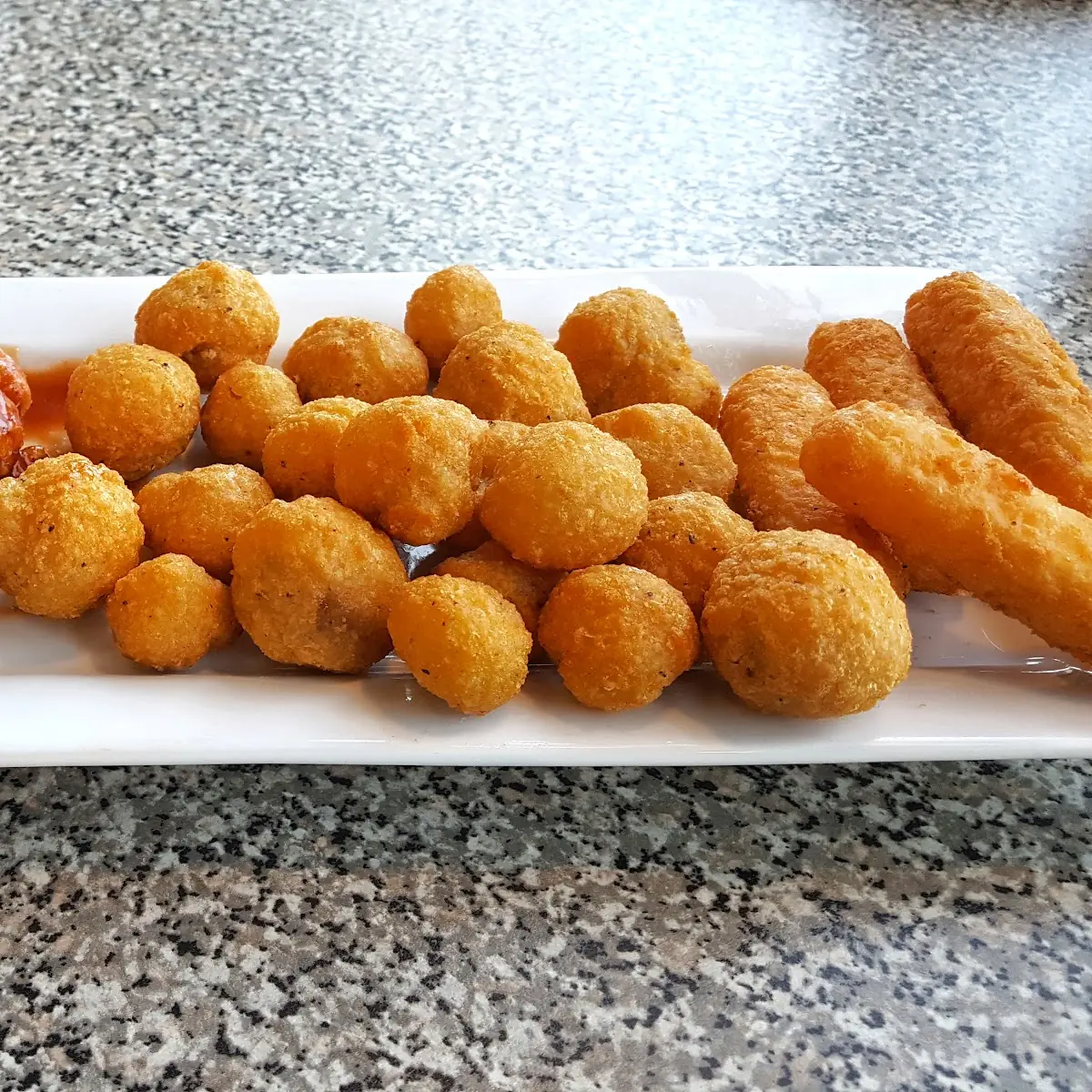 The Sampler Fried Mushrooms Mozzarella Sticks Boneless Chicken Wings