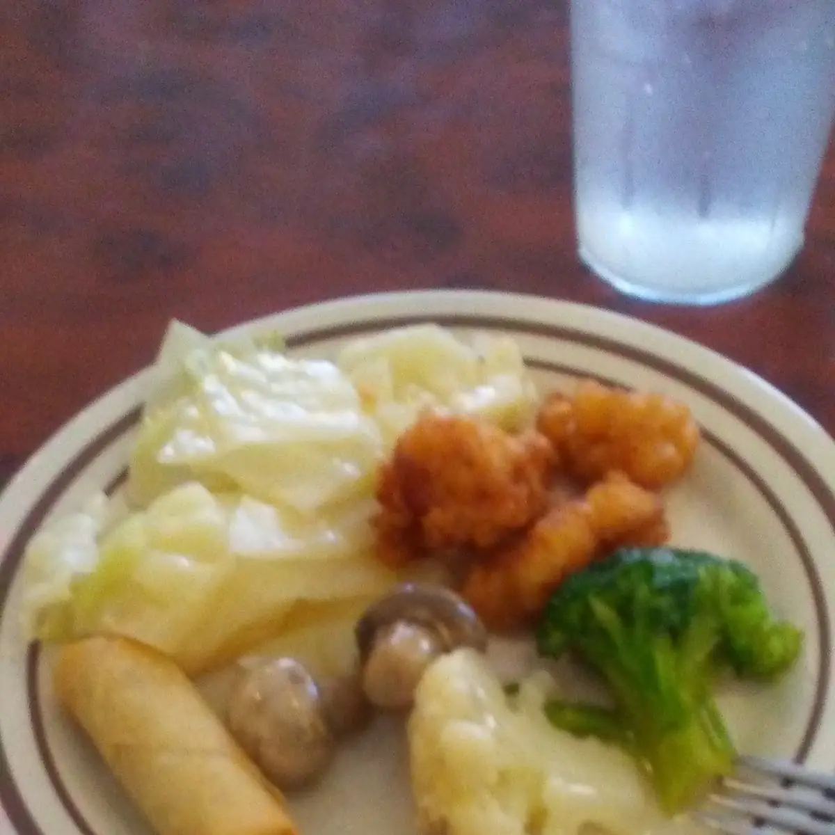 Buffet Style Spring Roll Cabbage Black Pepper Chicken Cauliflower Broccoli and Button Mushrooms