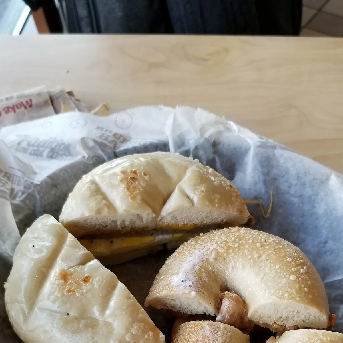 A Plain Bagel with Egg Cheese and Sausage a Plain Bagel with Butter and Peanut Butter