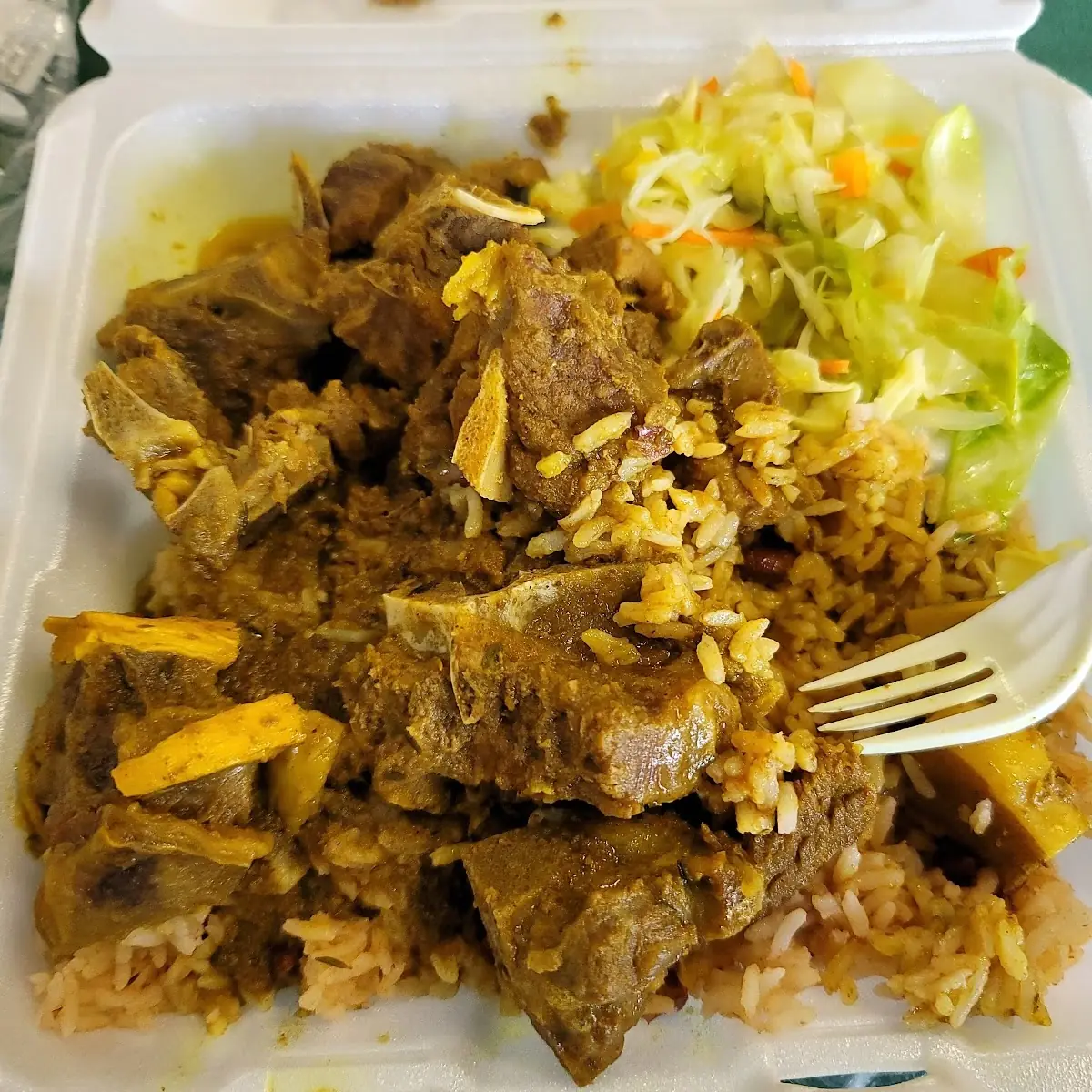 Goat Curry with Rice and Peas and Cabbage