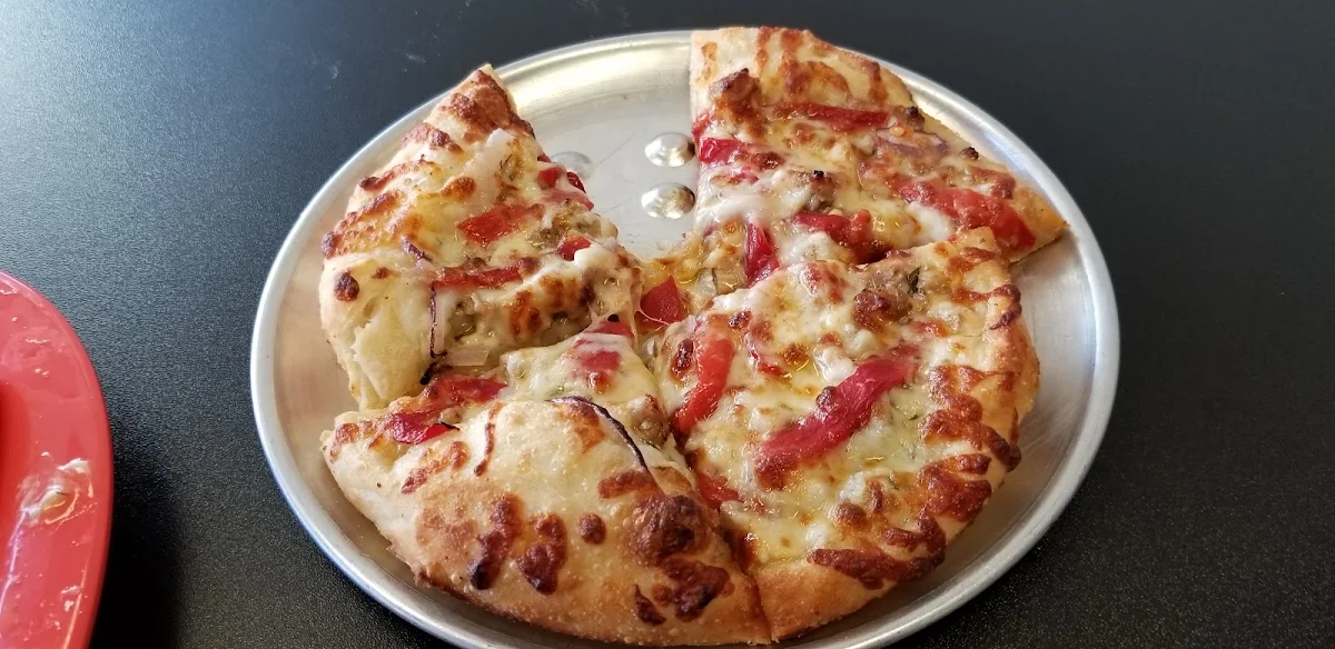 Pizza with Peppers Onions Sausage and Spinach