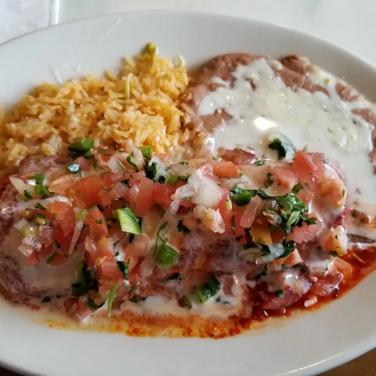 1 Bean Tostada 1 Cheese Enchilada with Rice & Beans