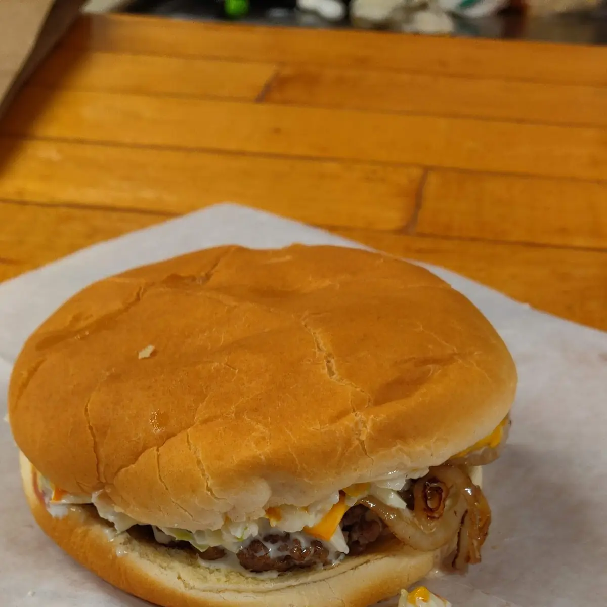 Cheeseburger with Grilled Onions and Slaw