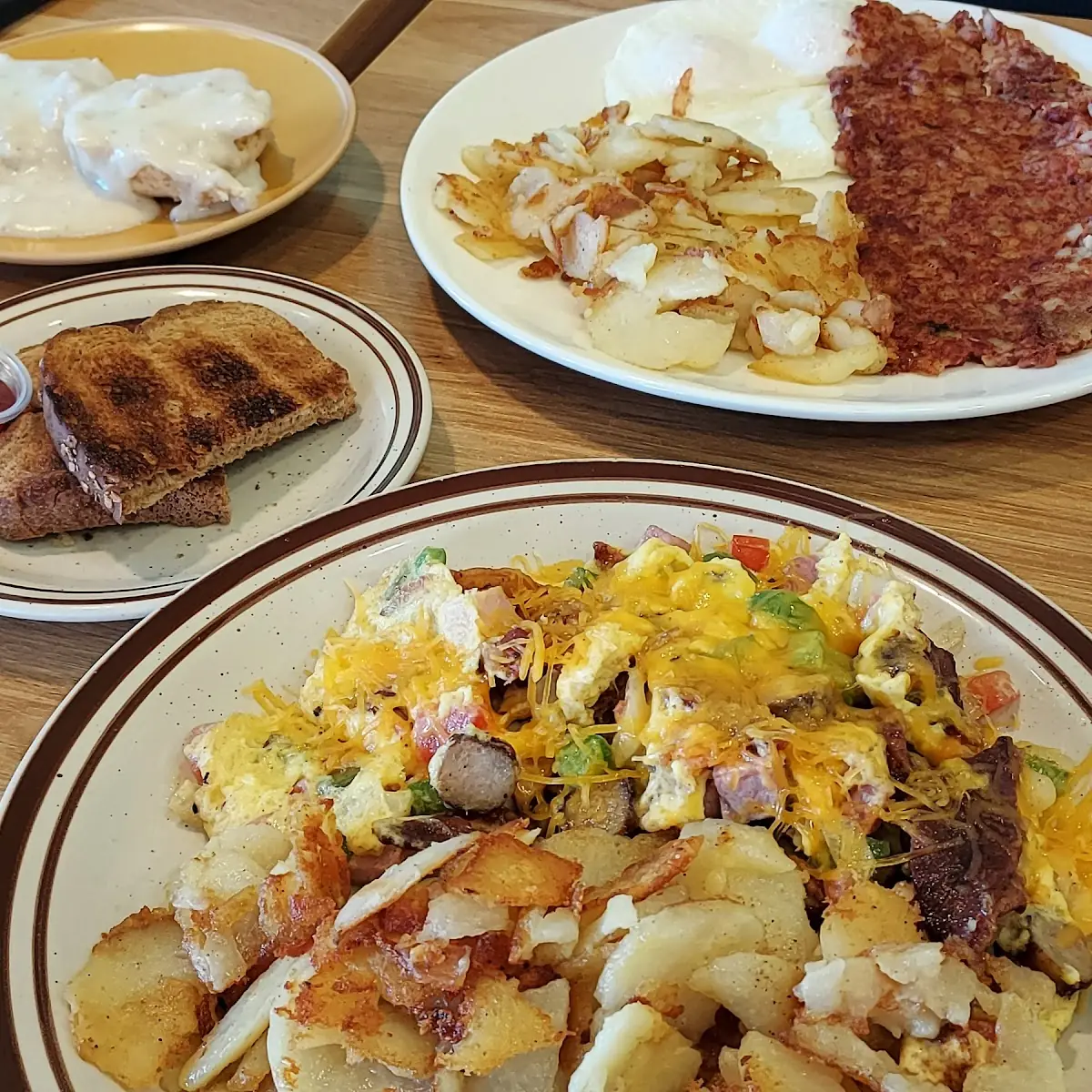 Bottom Hobo Omelet and County Potatoes- Top Corned Beef Hash