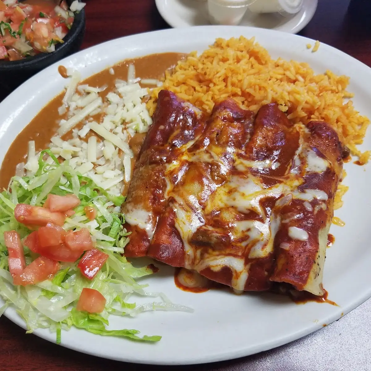 Steak Enchiladas with Red Sauce Rice and Beans