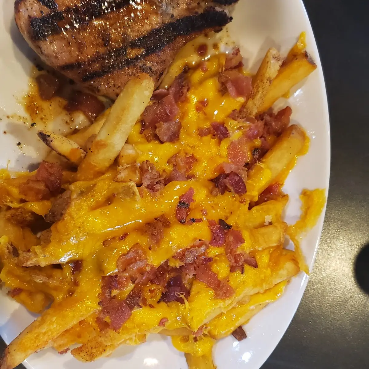 Grilled Pork Chop and Bacon Cheese Fries