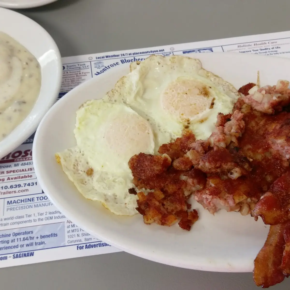 Two Eggs with Choice Meat & Corned Beef Hash or Biscuit & Gravy