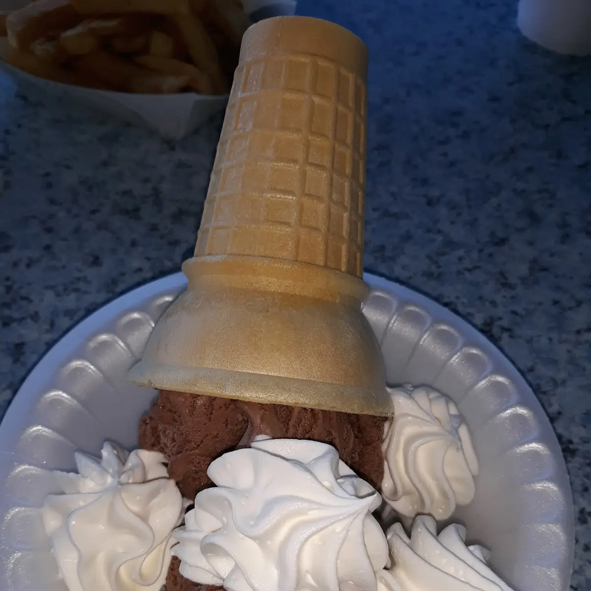 Chocolate and Vanilla Ice Cream Cones with Whipped Cream
