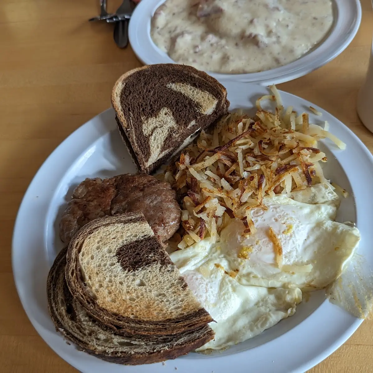 Over Easy Eggs Sausage Hash Browns and Rye Toast