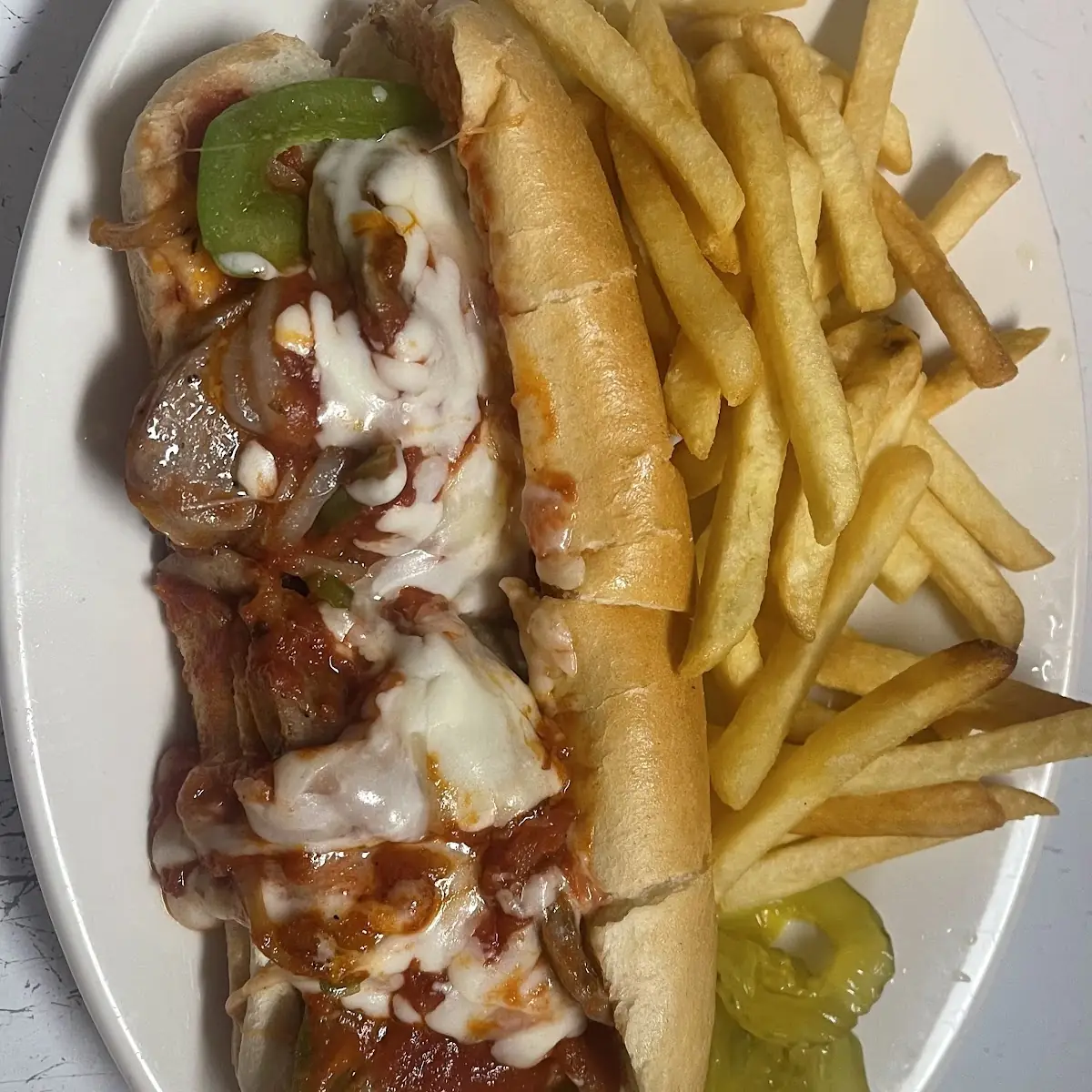 Chicken Philly Cheese with Pepper Onion Mushrooms & Mozzarella Served with French Fries & Pickle