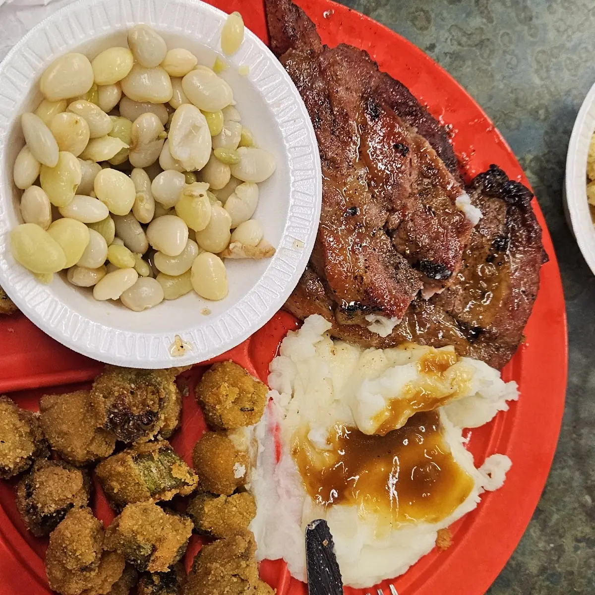 Pork Steak with Mash Potatoes Lime Beans and Okra