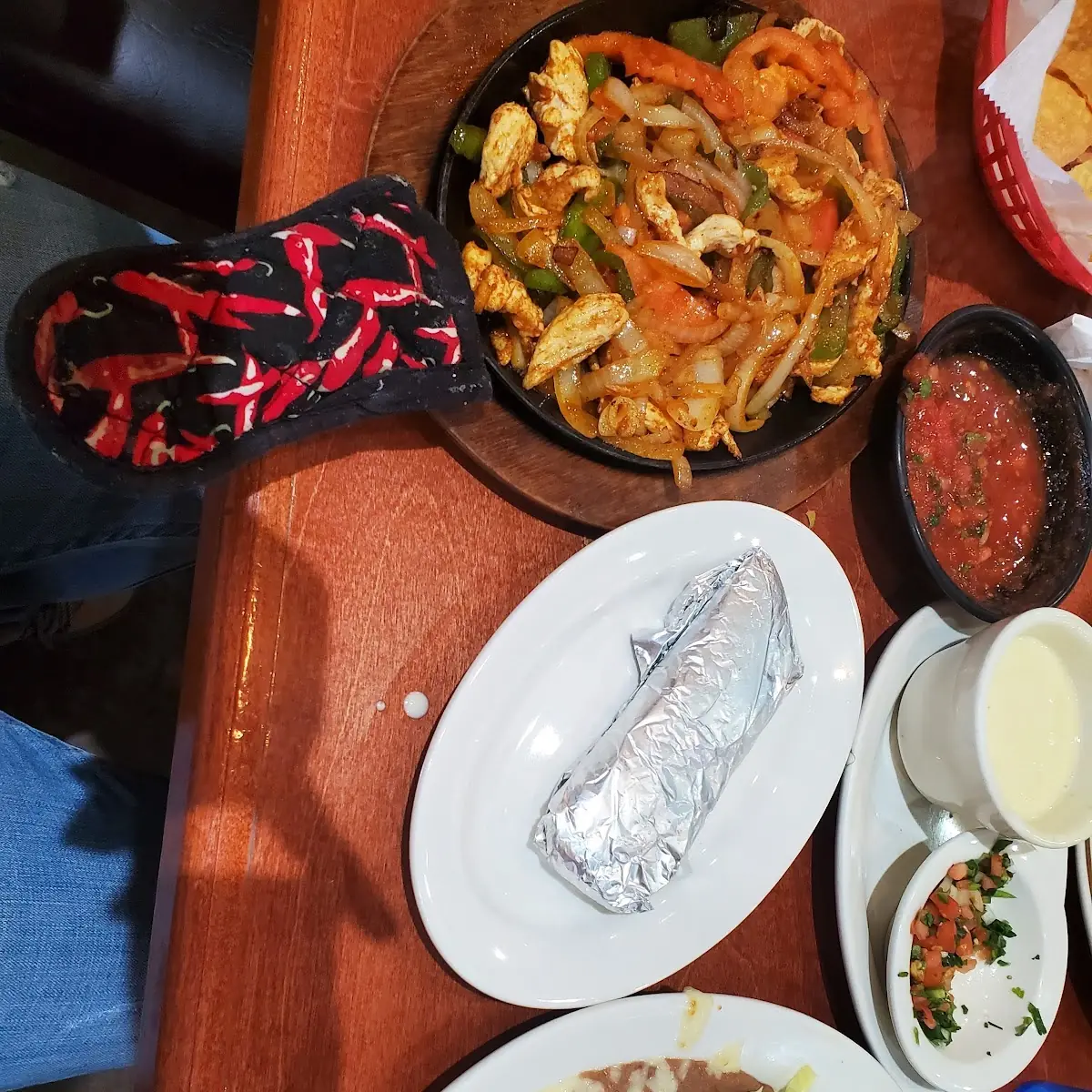 One Guacamole Tostada One Enchilada Rice and Beans with Cheese