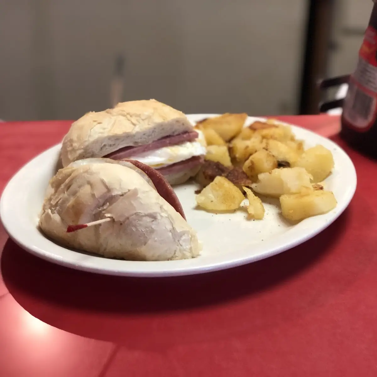 Pork Roll Egg and Cheese Sandwich on a Kaiser Roll with Home Fries