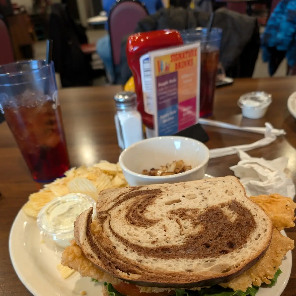 Catfish Sandwich on Swirled Rye with Chips