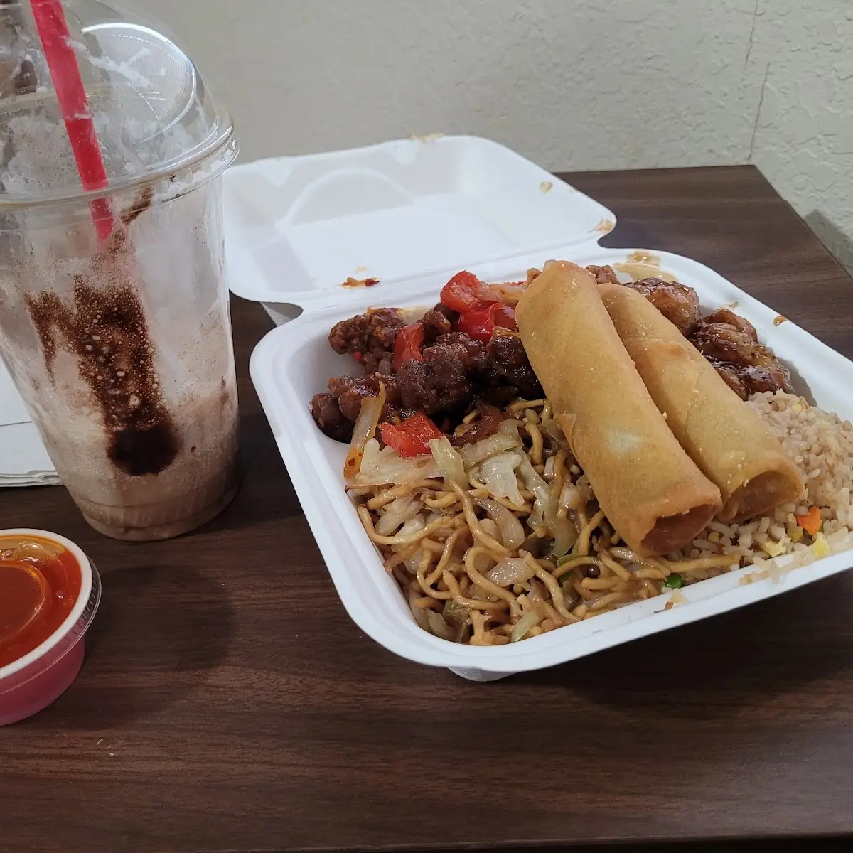 Orange Chicken Chow Mein Beef Broccoli and Egg Rolls