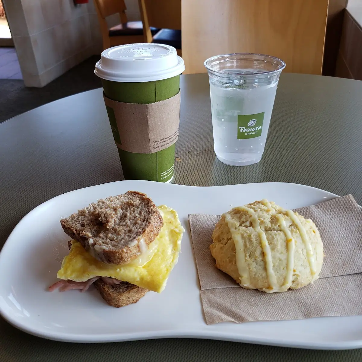 Ham Scrambled Egg & Cheese on Farmhouse Bread Orange Scone Madagascar Vanilla Latte