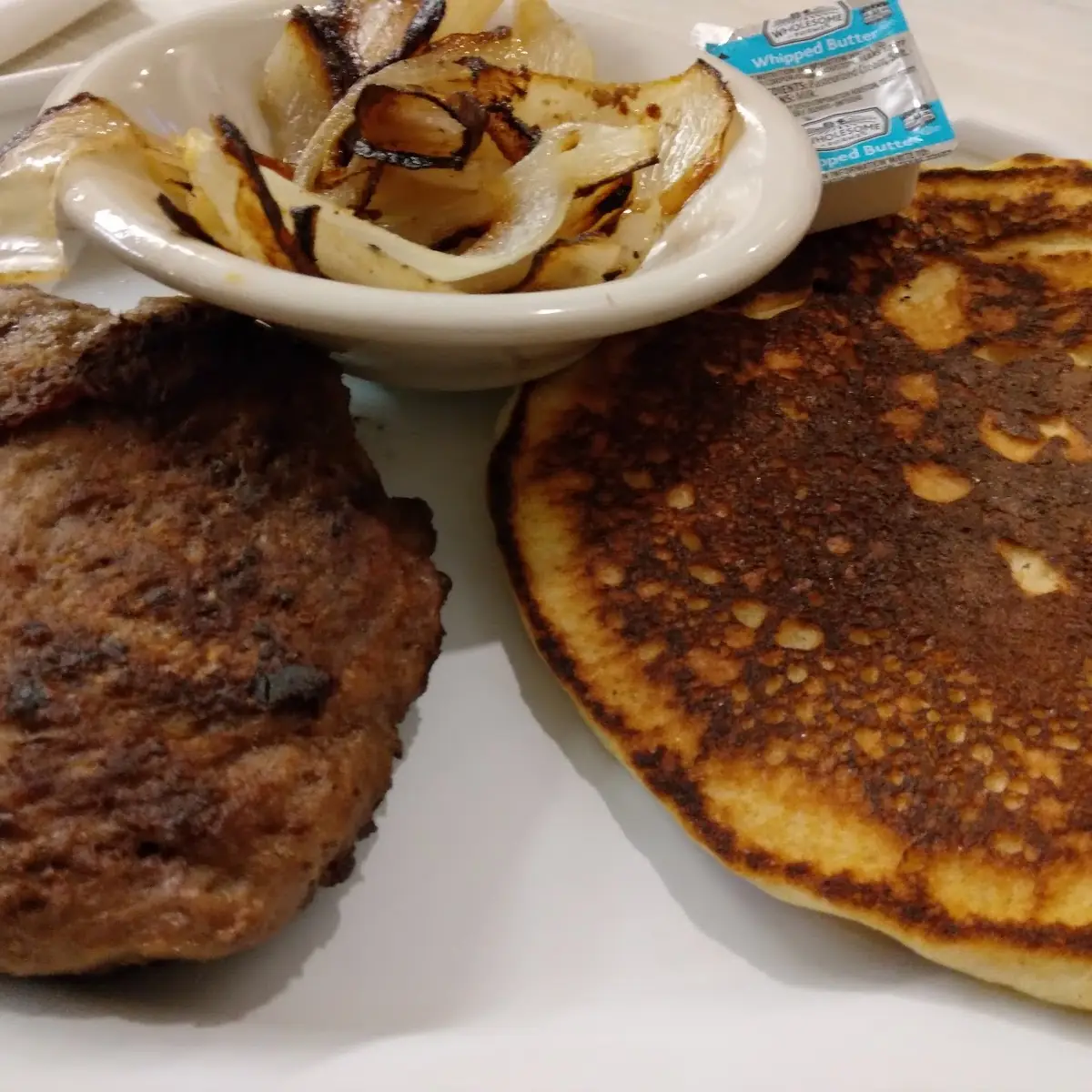 Chop Steak with Grilled Onions and Fried Cornbread