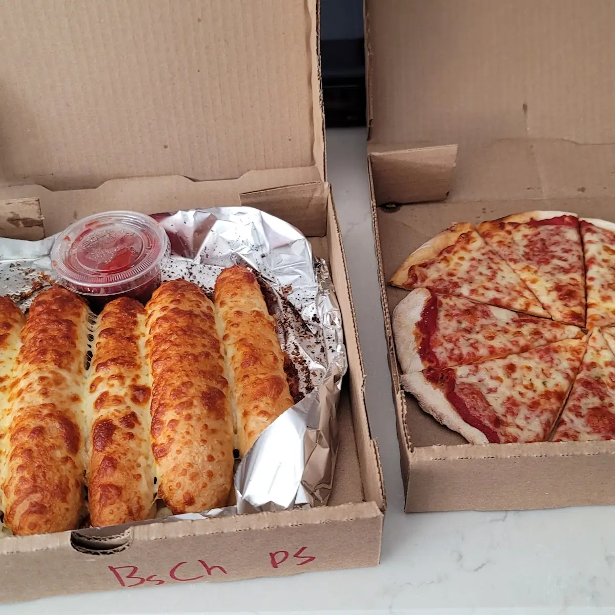 Garlic Cheese Bread Sticks and a 9 Inch Cheese Pizza