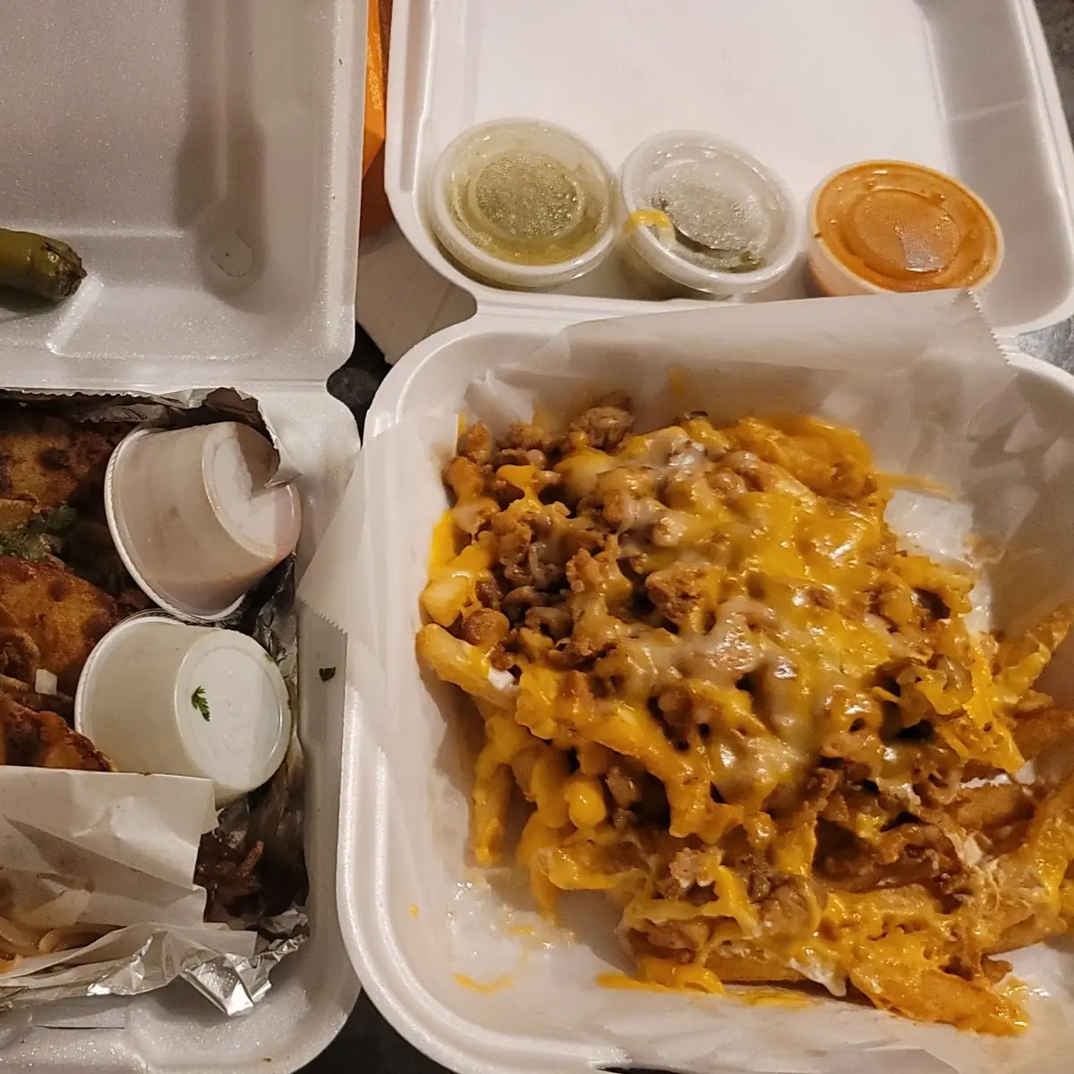 Birria Tacos Carne Asada and Nacho Fries with Chicken and Cheddar