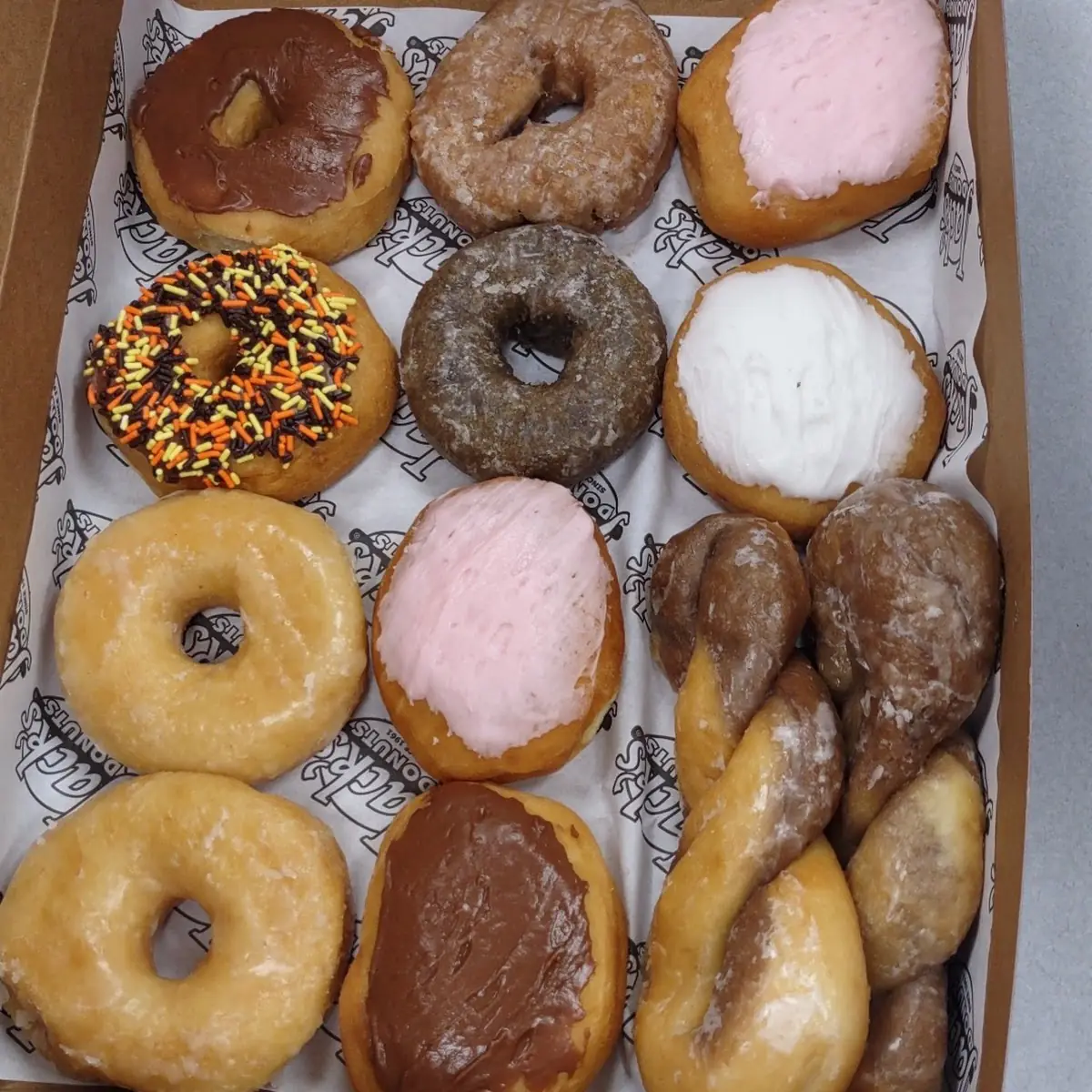 Dozen Assorted Donuts Minus One That Was Scarfed