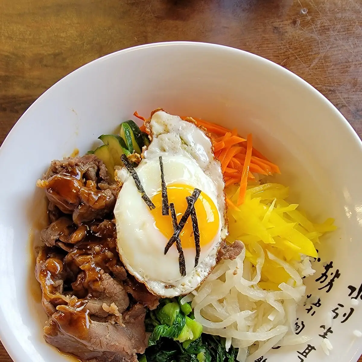 비빔밥 Bibimbap Korean Rice Bowl with Mixed Vegetables and Grilled Beef