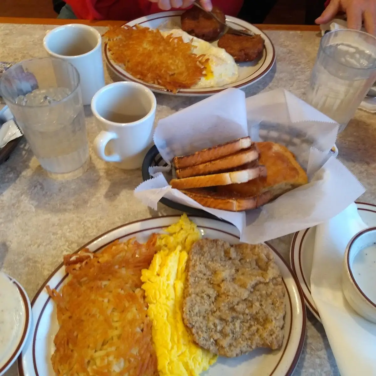 Country Fried Steak with Crispy Hash Browns Eggs and Biscuits and Gravy