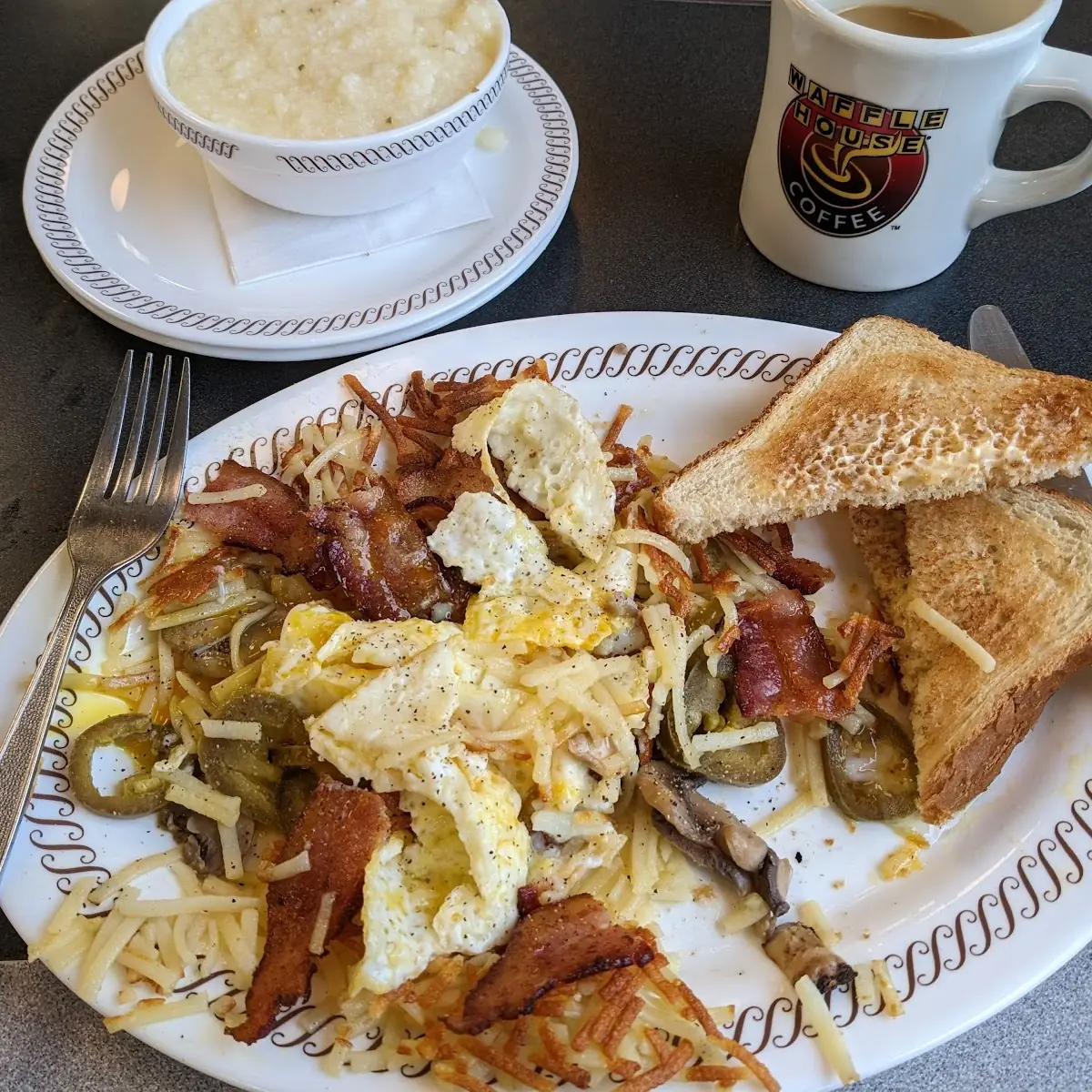 Scattered Smothered Capped and Peppered with Bacon and Two Eggs Sunny Side Up on Top