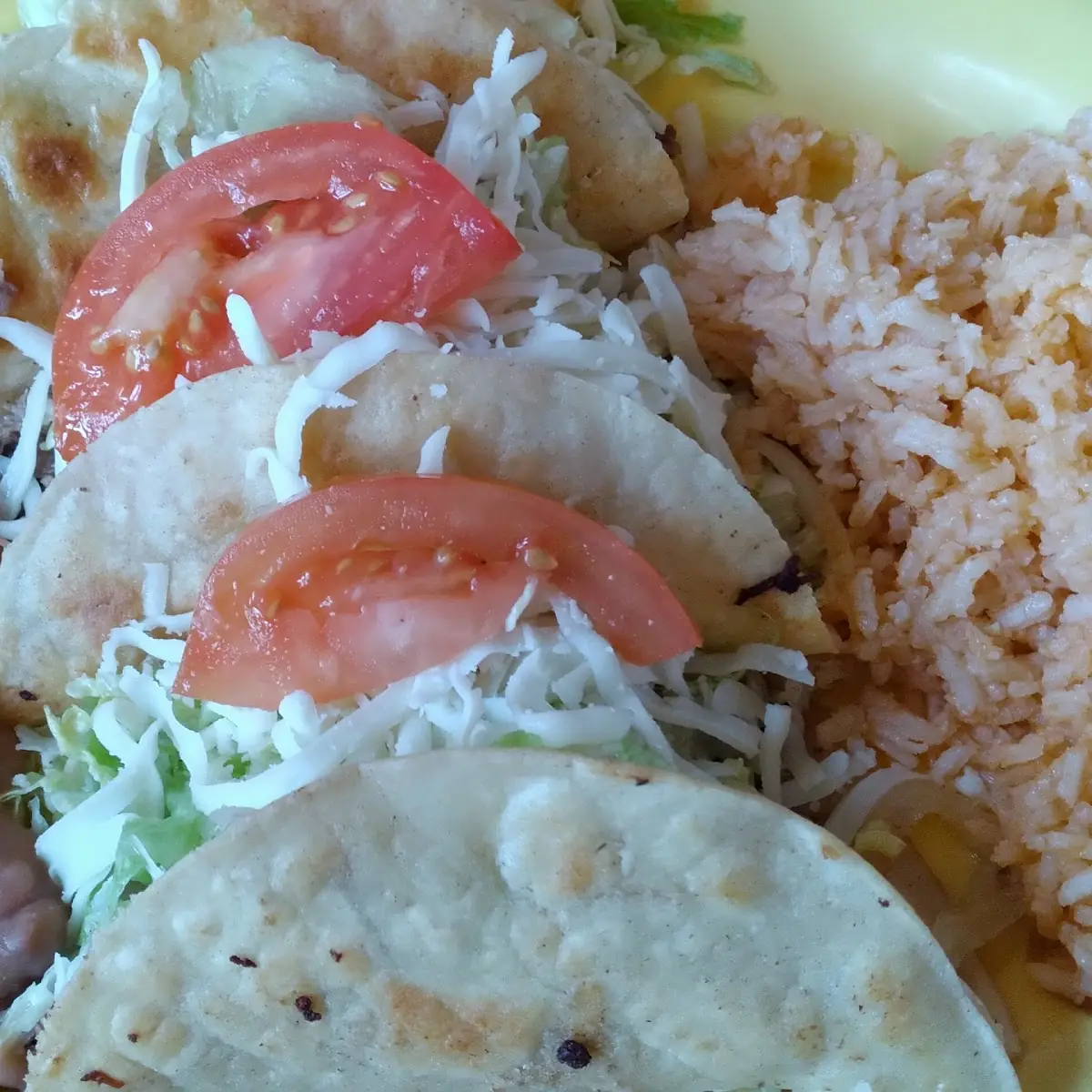 Two Beef and Potato Tacos Rice & Beans