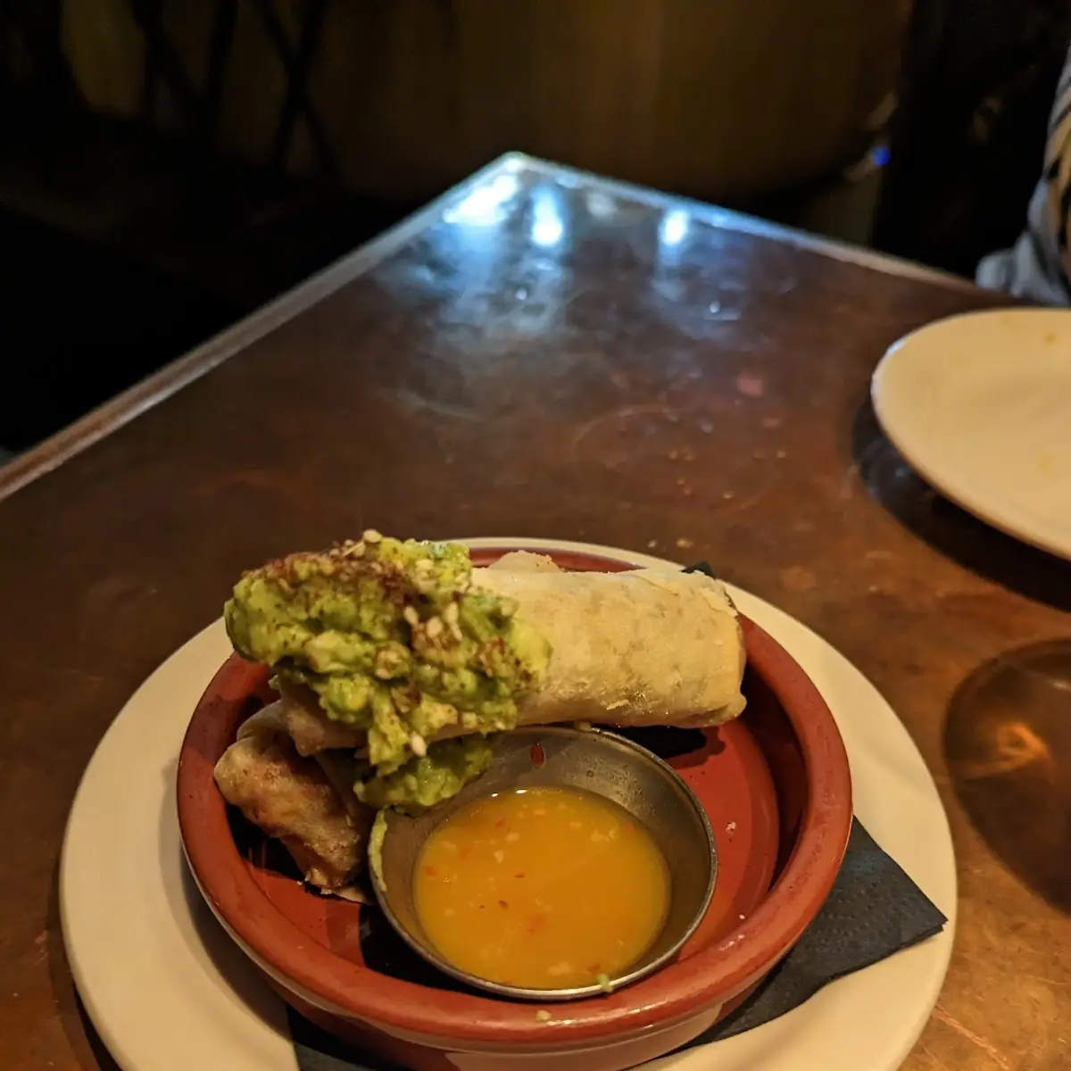 Pomegranate Braised Pork Spring Rolls Avocado Zaatar Mango Mojo