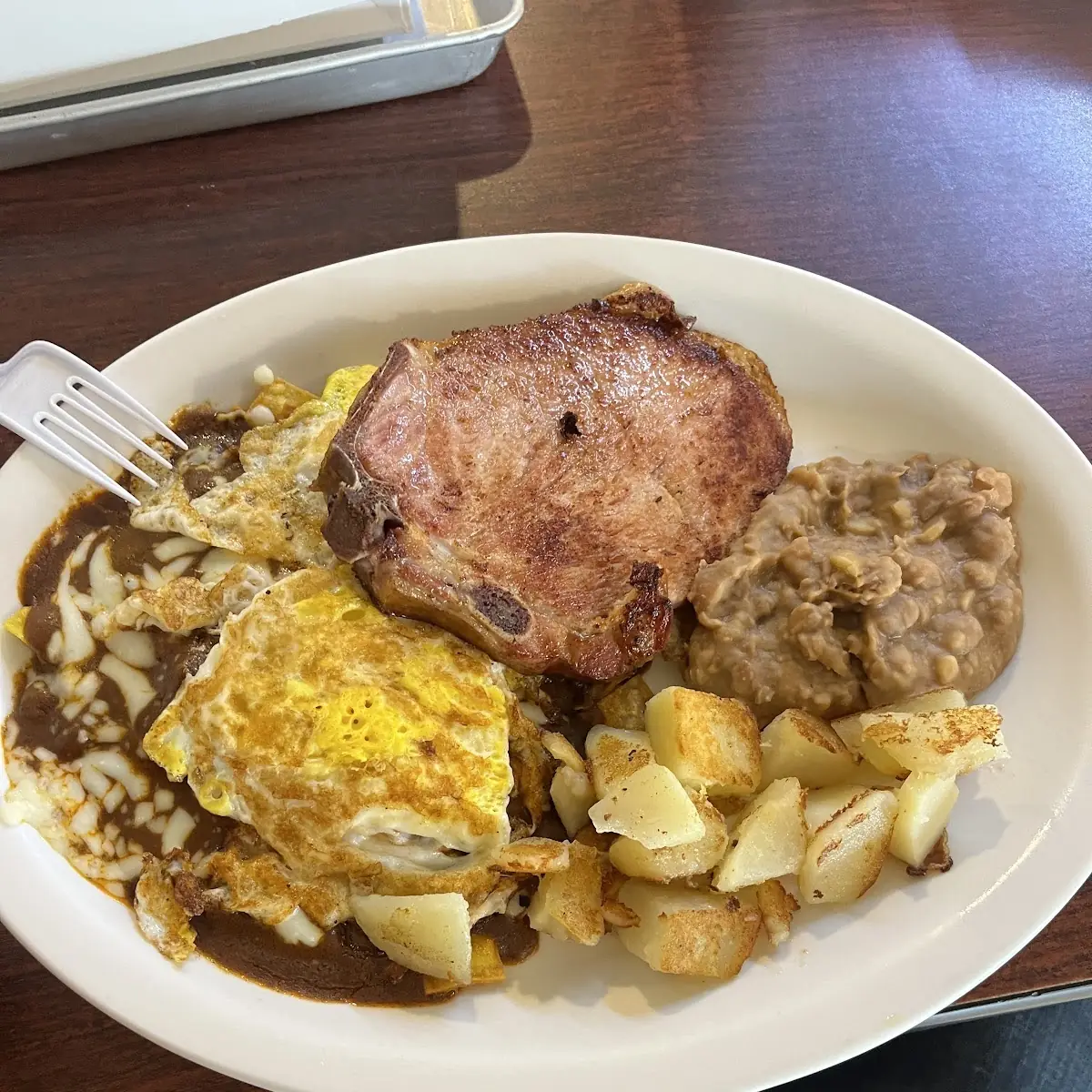 Chilaquiles Rojos Whit Pork Chop