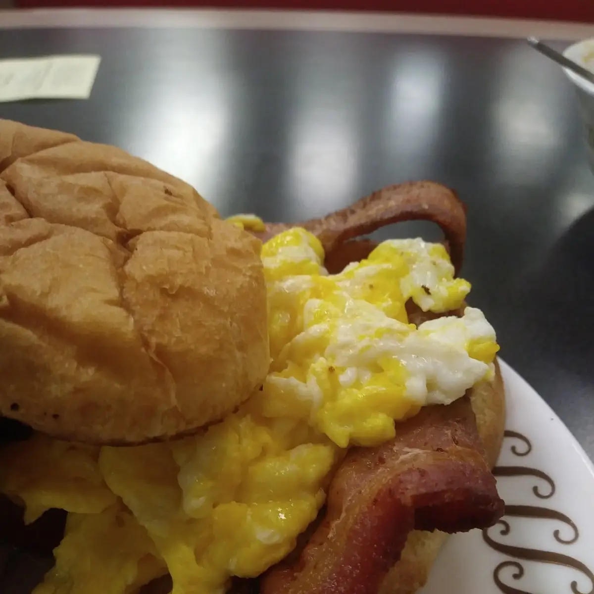 Scrambled Egg and Bacon on a Grilled Bun