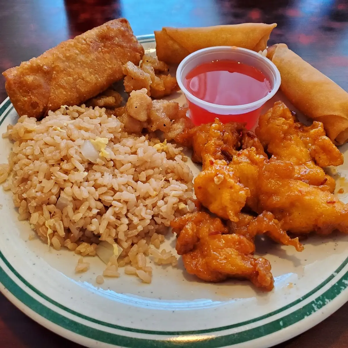 Korean Chicken Vegetable Fried Rice Egg Rolls and Spring Rolls