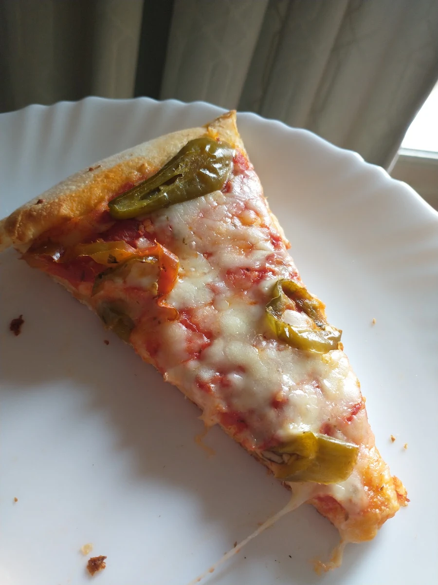Very Lightly Done Pizza with Hot Italian Peppers Reheated in Toasted Oven Next Day