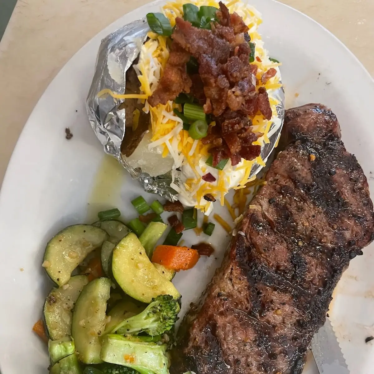 New York Steak Loaded Baked Potato and Veggies