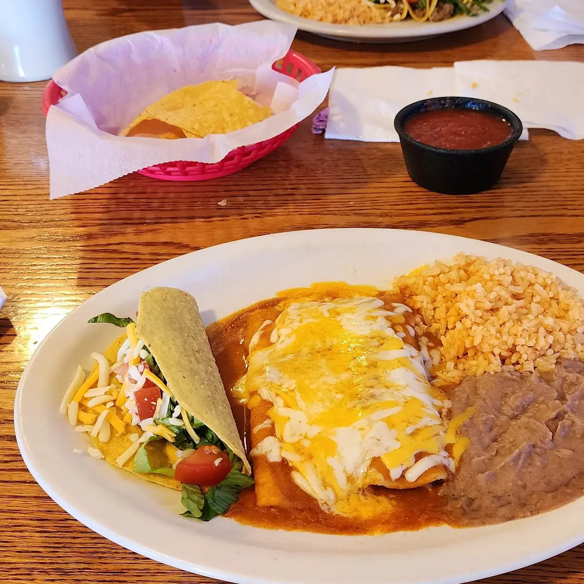 1 Beef Enchilada 1 Cheese Enchilada 1 Beef Crunchy Taco with Rice and Beans