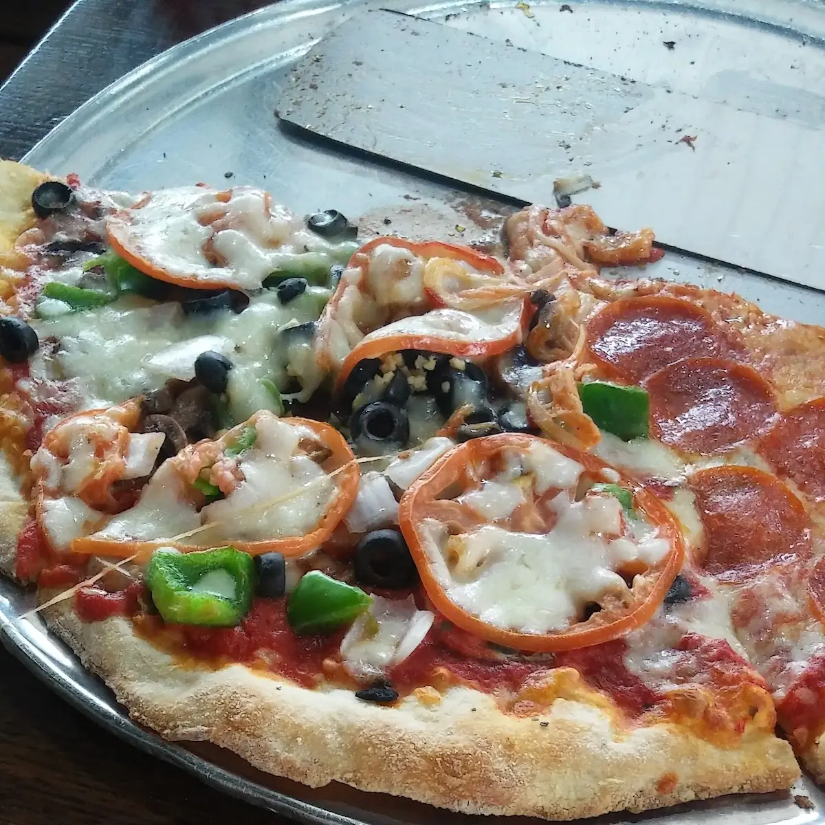 Pizza by the Sliced Tomatoes