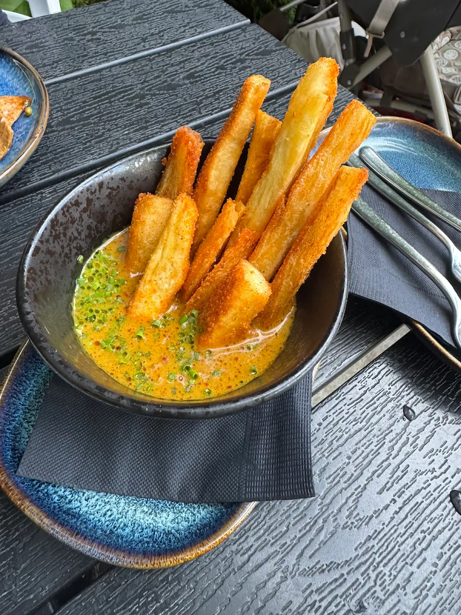 Mogo Fries with Cumin Mashed Potatoes in Bengali Curry