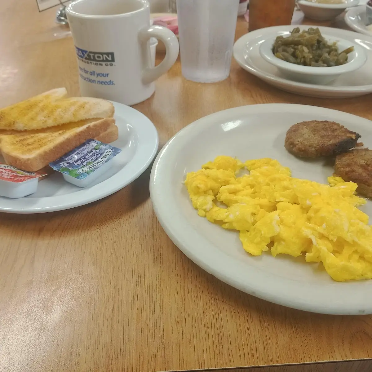 Scrambled Eggs Sausage and Toast with Butter