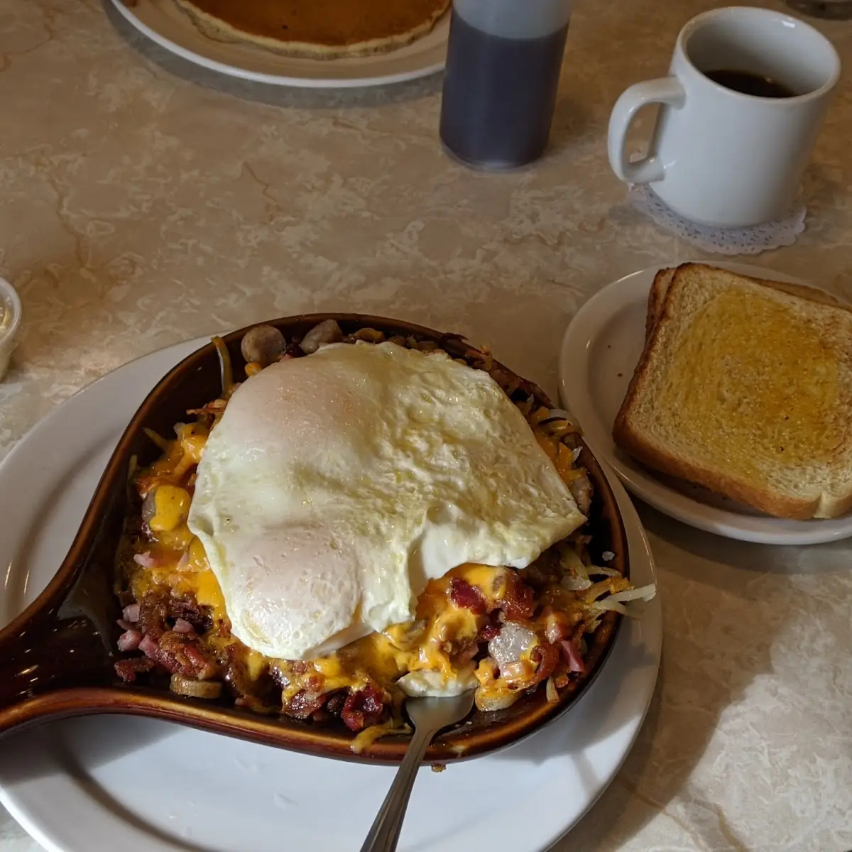 Meat Skillet with Eggs over Easy