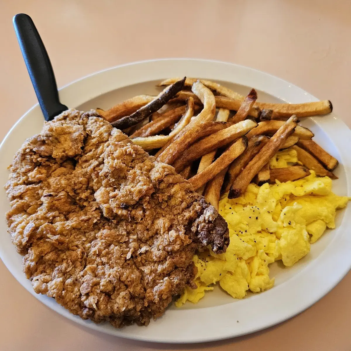 Scrambled Eggs Chicken Fried Steak and Fries