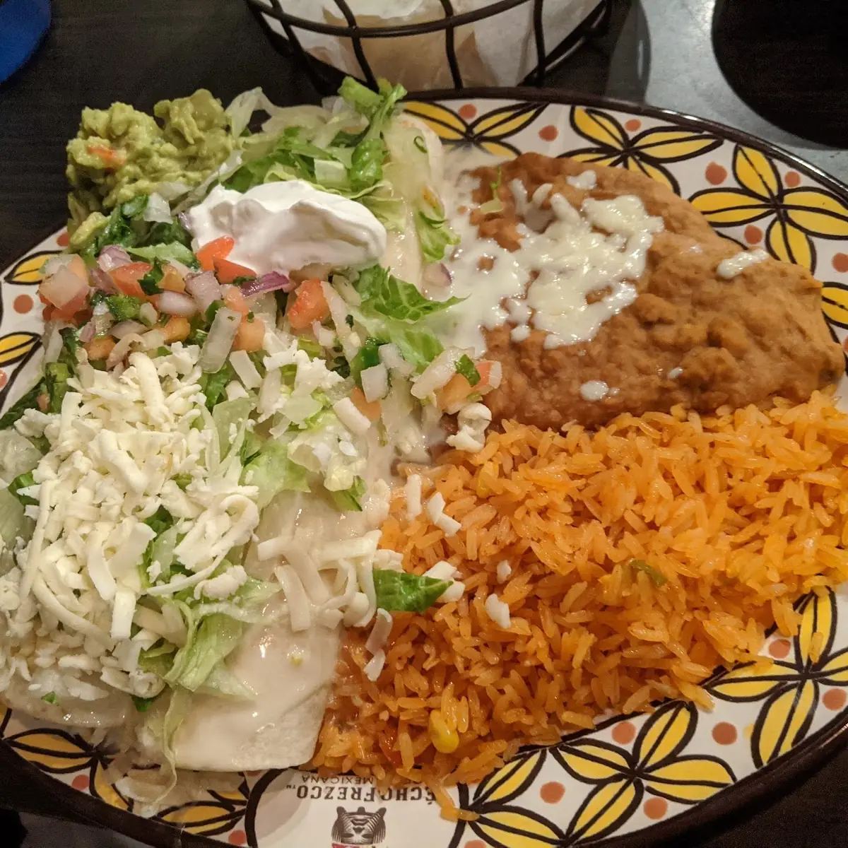 A Beef Tostada Enchilada & Burrito